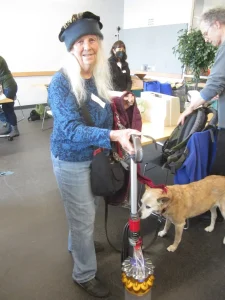 Lady holding vacuum cleaner